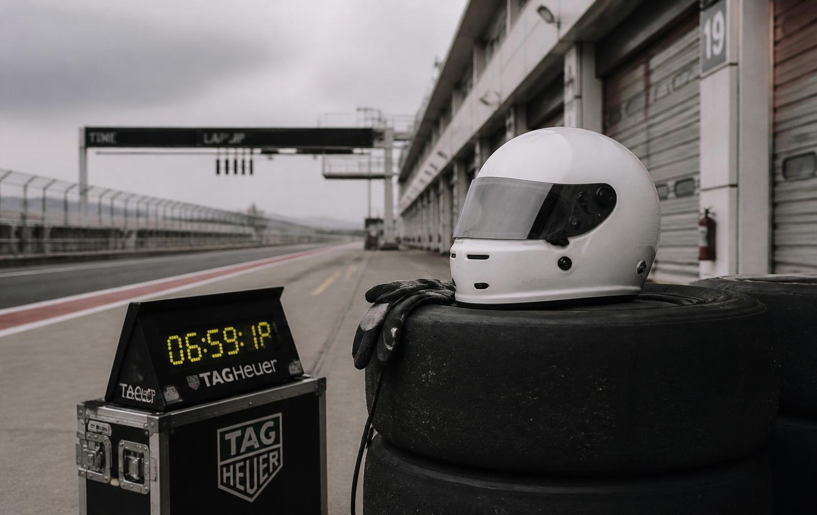 Race paddock with helmet and timing equipment